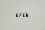 Simple and minimalist text reading 'OPEN' on a white background, ideal for business use.